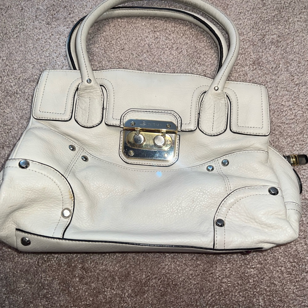 B. Makowsky brand handbag. Cream color. Leather material.